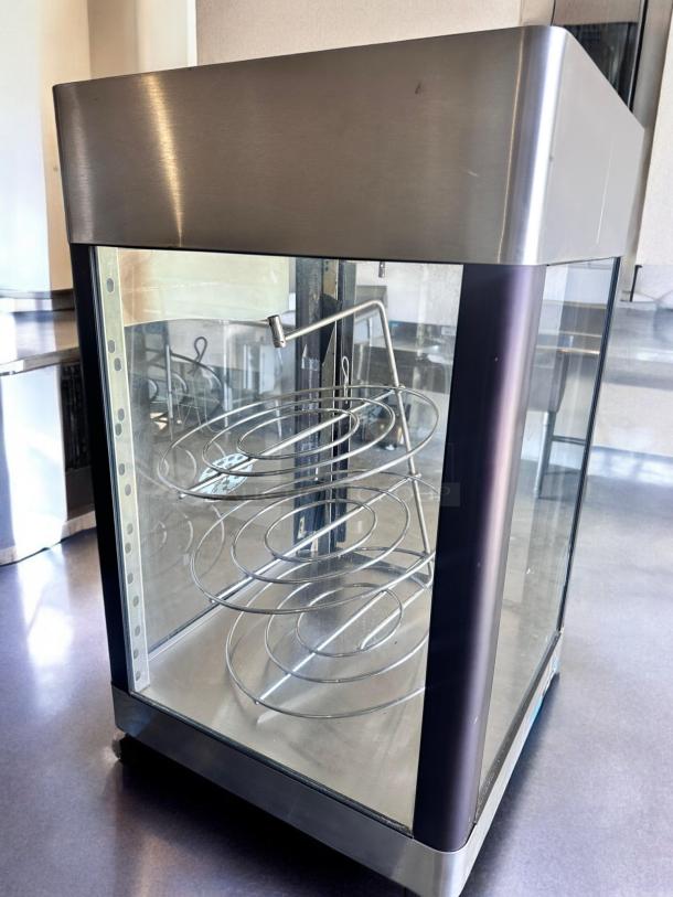 Star HFD-2A heated display cabinet with rotating racks, excellent condition, stainless steel, glass panels, 120V, fully tested.