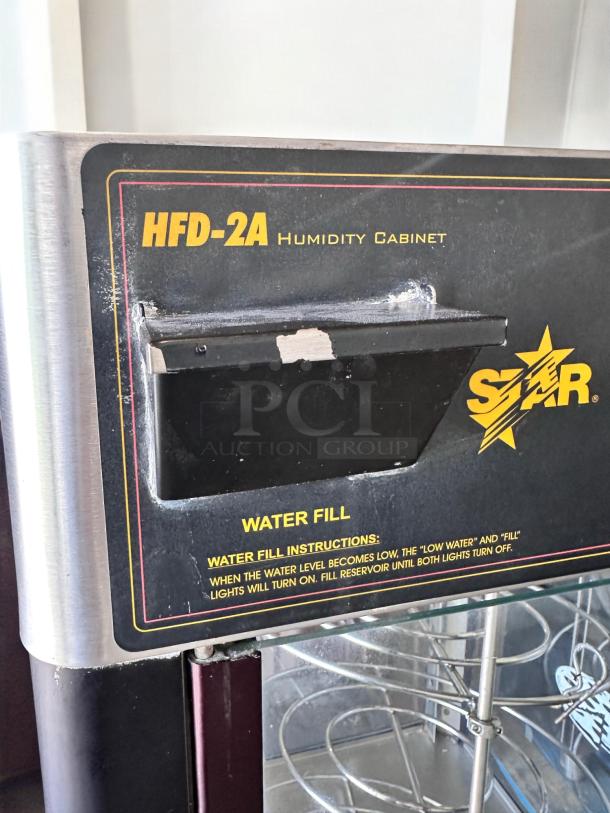 Star HFD-2A heated display cabinet, excellent condition, rotating racks, 120V, visible water fill instructions, fully tested.