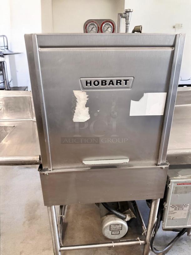 Hobart AM-12 high-temp door-type dishwasher in excellent condition; visible controls; tested, 208-240V model.