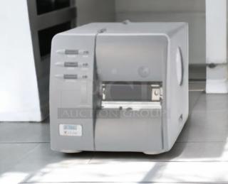 Brand New Datamax-O’Neil DMX-M-4210 industrial label printer, 300 DPI, high-performance printing, gray exterior.