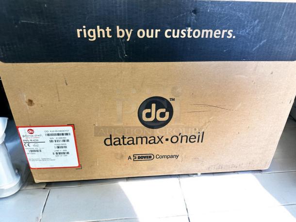 Brand new Datamax-O’Neil DMX-M-4210 industrial label printer box, 300 DPI, high-performance, packaging intact.