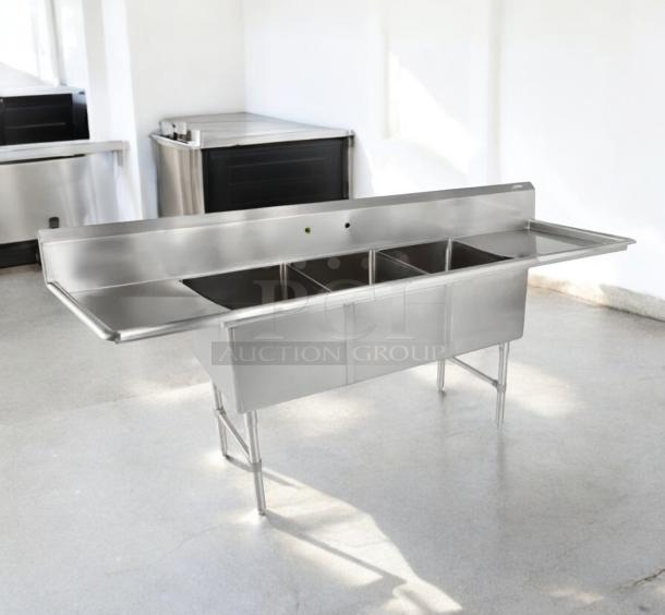 Stainless steel 3-compartment sink with dual drainboards, 132"L x 31"W x 42"H, excellent condition, fully tested.