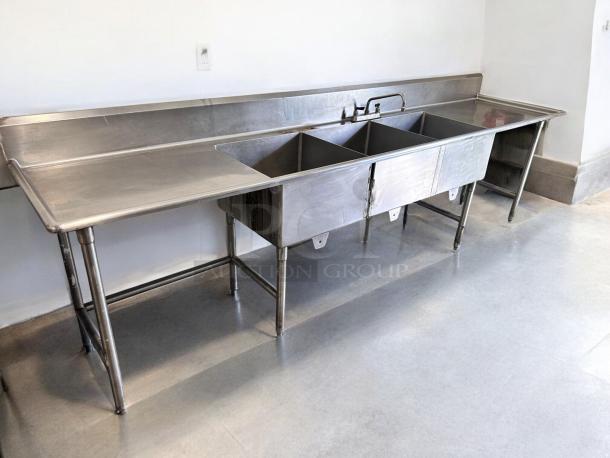 Stainless steel 3-compartment sink with dual drainboards, excellent condition, 132"L x 31"W x 42"H, fully tested and working.