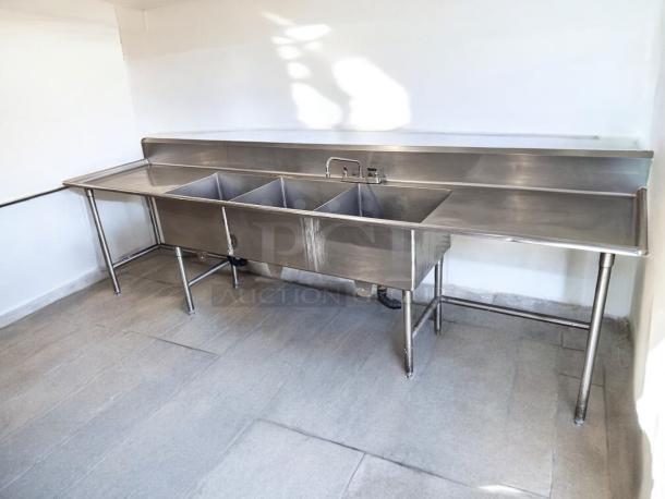 Stainless steel 3-compartment sink, 132"L x 31"W x 42"H, excellent condition, dual drainboards, fully tested and working.