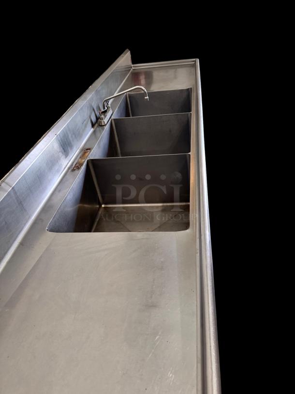 Stainless steel 3-compartment sink with dual drainboards, 132"L x 31"W x 42"H, excellent condition, fully tested.