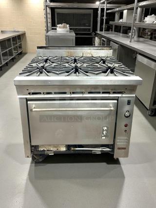Montague 136-5 Legend gas range, six burners, 36", heavy-duty, excellent condition, fully tested, visible manufacturer label.