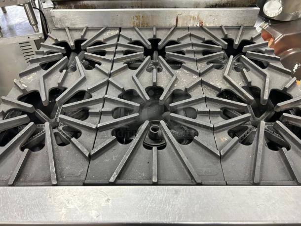 Montague 136-5 Legend 36" heavy-duty gas range with six open burners, excellent condition, fully tested and working.