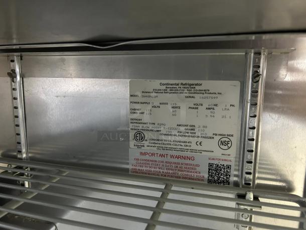 Continental Refrigerator SW48-N-18M label; model, power specs, ETL, NSF markings visible inside stainless steel interior.