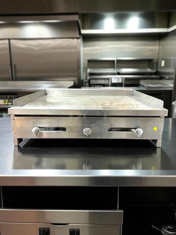 Stratus SMG-36 flat top griddle, natural gas, fully tested, excellent condition, stainless steel, three control knobs.