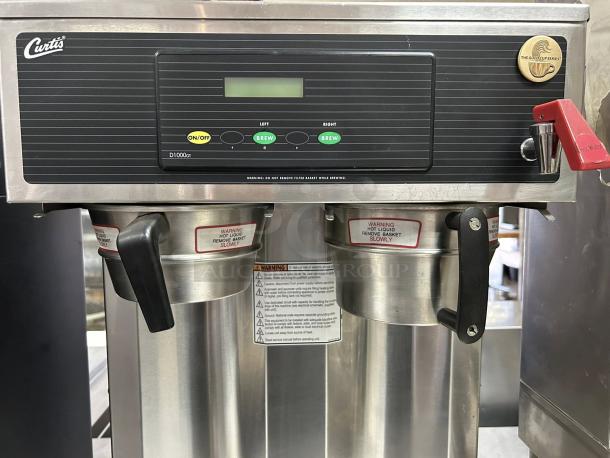 Curtis D1000GT12A000 twin airpot coffee brewer, 220V, great condition, tested, features digital controls and stainless steel body.