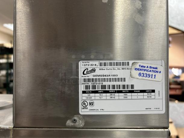 Curtis GEMSS63A1000 Automatic Coffee Brewer label, including model, serial, and electrical specifications, plus identification sticker.