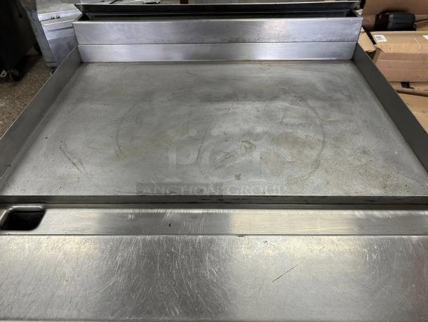 Jade JTRH-36G-36 heavy-duty gas range, 36" full griddle, manual controls, standard oven, in working condition, 140,000 BTU.