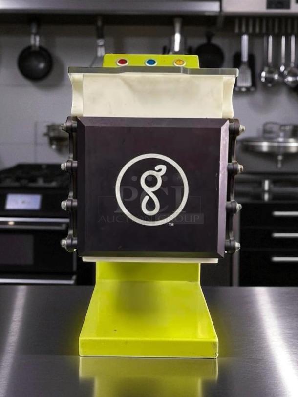 Goodnature GT7 cold pressed juicer, excellent condition, fully tested, yellow base, iconic logo on the front panel.