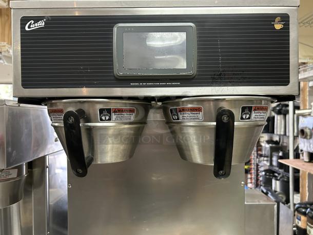 Curtis G4GEMT10A1000 twin satellite coffee brewer, great condition, 1 1/2 gal capacity, visible scalding hazard labels.