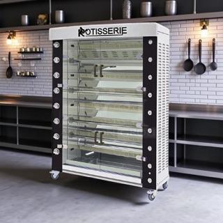 Commercial rotisserie oven with glass doors, five stainless steel spits, on casters. Logo reads "ROTISSERIE." Modern kitchen setting.