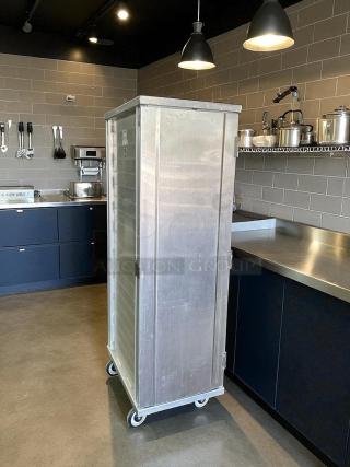 New Age 1290 mobile enclosed pan rack, excellent condition, holds (40) 18"x26" pans, HD base, fully tested, on wheels.