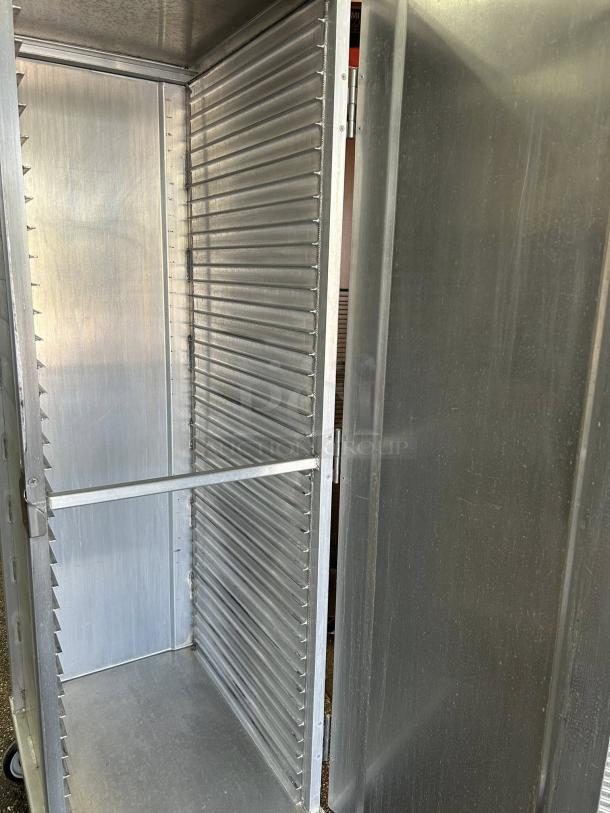 New Age 1290 mobile enclosed pan rack, holds 40 pans, excellent condition, HD base, fully tested, aluminum construction.