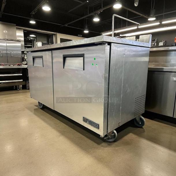 True TUC-60F-HC 60" stainless steel undercounter freezer, solid doors, excellent condition, fully tested, on casters.