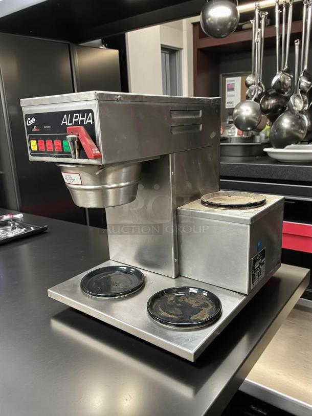 Curtis ALPHA 3DR-10 12 Cup Coffee Brewer with 3 right-side warmers. Stainless steel, great condition, fully tested, 120V.