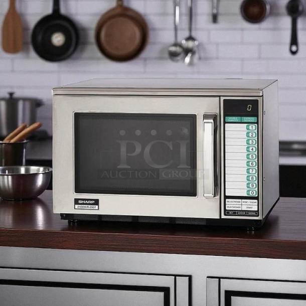 Sharp R23GTF stainless steel commercial microwave oven, 1600 watts, fully tested and working, keypad controls, sleek design.