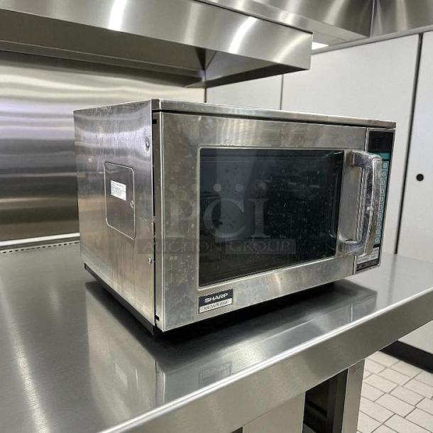 Sharp R23GTF stainless steel commercial microwave oven, 1600 watts, fully tested, working, clean exterior, keypad controls.