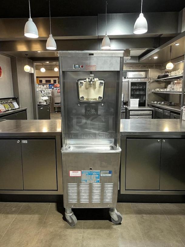 Taylor Y339-27 soft serve ice cream machine, excellent condition, 208/230V, fully tested, visible pull-down mechanism and labels.