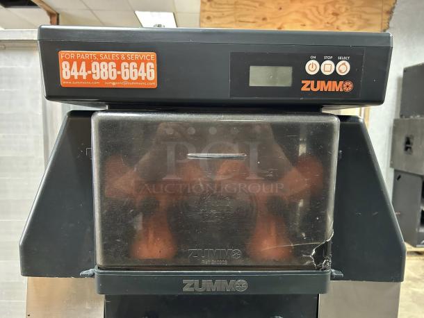 Zummo Z40-N commercial juicer, tested and working, showing control buttons and service contact label, visible wear on cover.