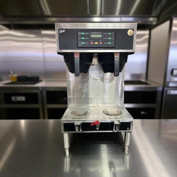 Curtis GEMTS10A1000 Automatic Twin Coffee Brewer with two lower warmers and hot water faucet, in great condition.