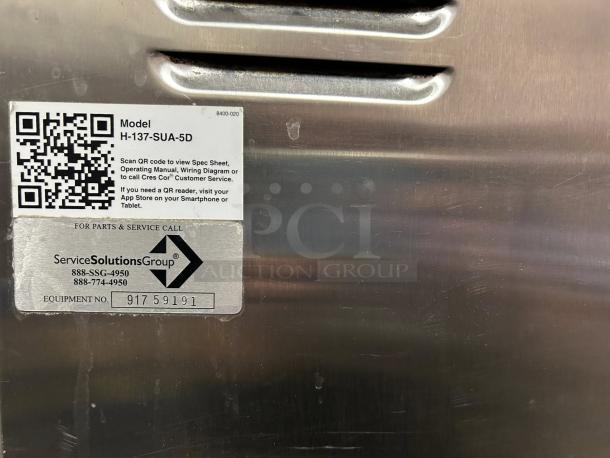 Cres Cor H-137-SUA-5D label with QR code, model info, and service contact on stainless steel surface.