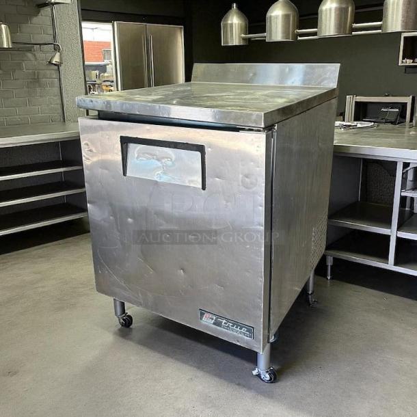 True TWT-27F-HC 28" worktop freezer in excellent condition with right hinge door, stainless steel finish, and caster wheels.