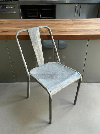 Silver aluminum outdoor dining chair, great condition, tested and working. Features a sleek, minimalist design.