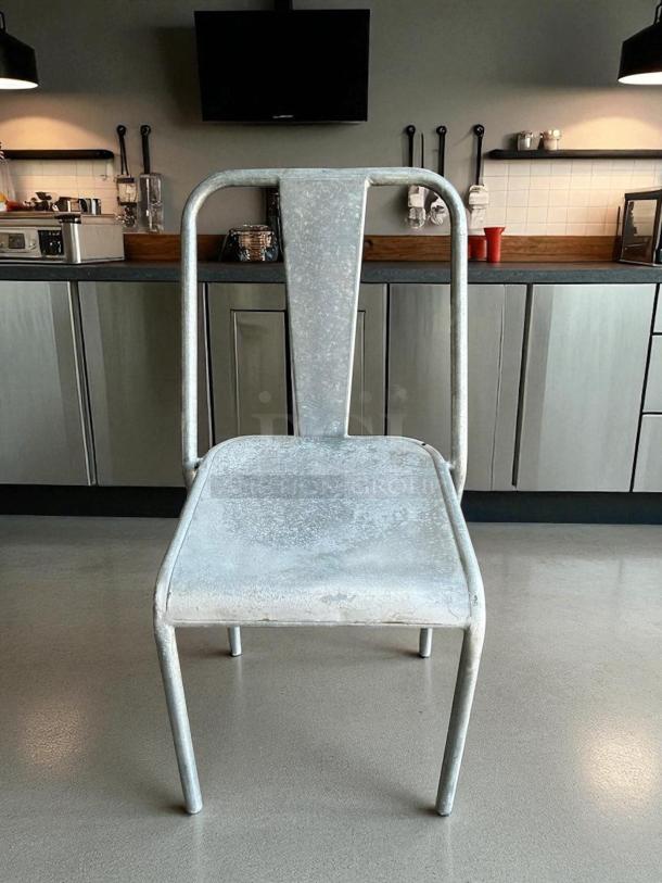 Silver aluminum outdoor dining chair in great condition. Fully tested and functional. Simple and durable design.