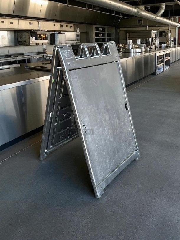 Signicade black plastic A-Frame Sign, 24x36", deluxe model, in excellent condition with visible mounting hardware.