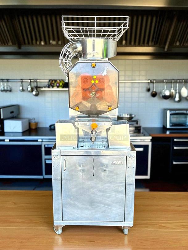 Citrocasa 8000 XB Advance Citrus Juicer in excellent condition, fully tested and working. Durable metal frame with visible Citrocasa logo.