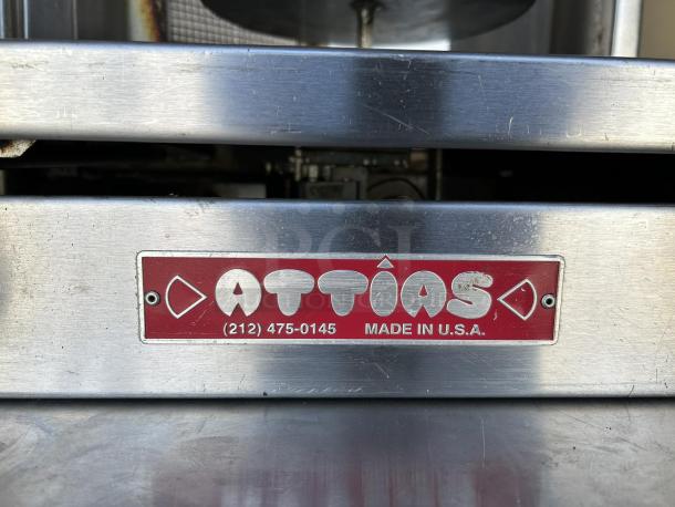Can't detect the portable bar in the image, focusing on metal surface with red "Attias, Made in U.S.A." label.