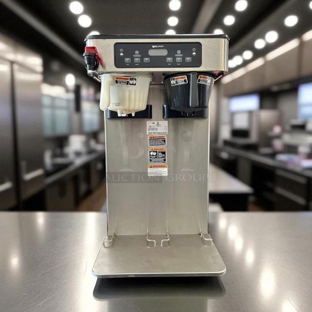 Bunn ITCB Twin HV Tea/Coffee Brewer in great condition, dual spouts, control panel, 120/240V, fully tested, warning labels visible.