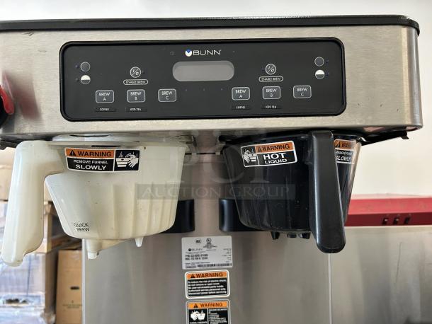Bunn ITCB Twin HV brewer in great condition, dual funnel system. Features include multiple brew options and caution labels.