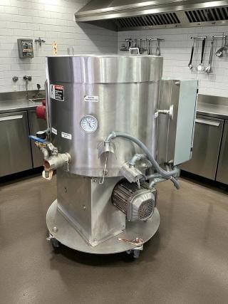 Savage Bros. Model #125 chocolate melter, 300 lb capacity, stainless steel, fully tested, excellent condition, visible gauges.
