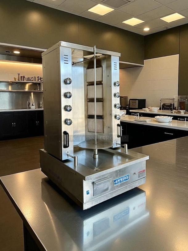 Attias GRY-8 electric gyro machine with 8 burners, 100 lbs capacity, stainless steel, tested and working condition.