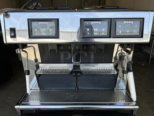 UNIC PONY 4 Super Automatic Espresso Machine, 4 groups, 2.6 gal boiler, 230v/1ph, excellent condition, touch panels visible.