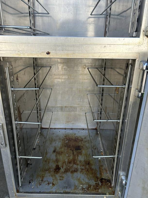 Alto-Shaam 1200-UP mobile heated cabinet, excellent condition, 16-pan capacity, interior racks, visible wear at base.