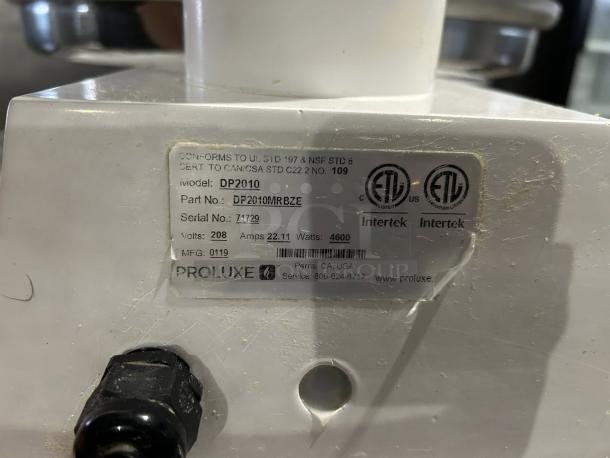 Proluxe DP2010M 22" pizza dough press, fully tested, with mold inserts. ETL certified label visible. Condition: excellent.