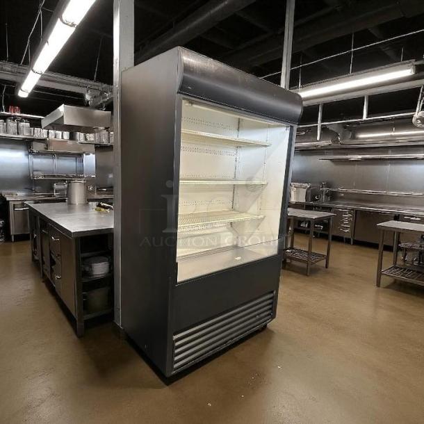 True TAC-48 air curtain merchandiser, great condition, 208/230V, fully tested, featuring open display shelves.