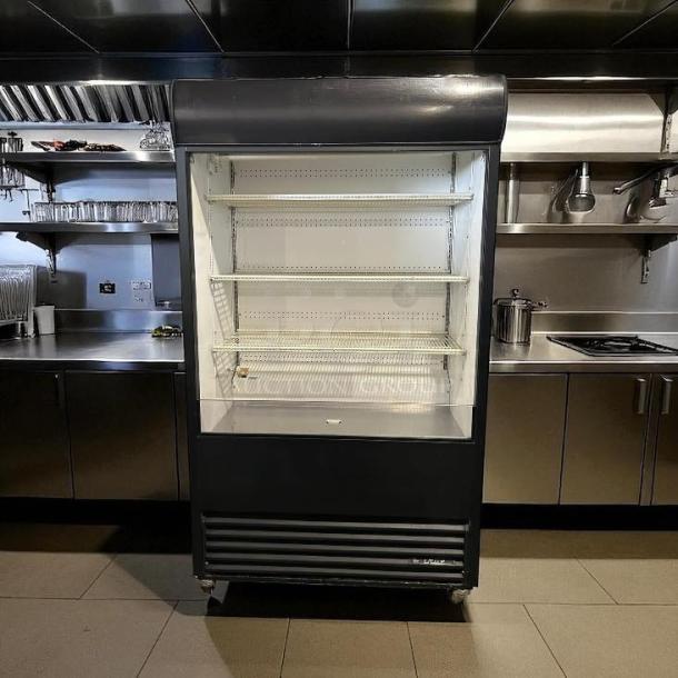 True TAC-48 air curtain merchandiser in great condition, 208/230V, fully tested and working, featuring multiple shelves.
