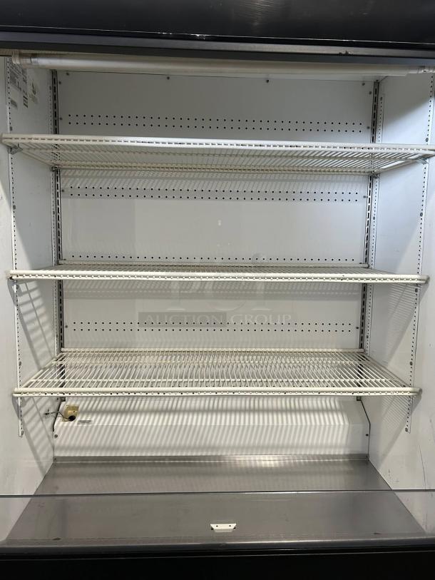 Great condition True TAC-48 air curtain merchandiser, 208/230V, fully tested. Features three wire shelves, clean interior.