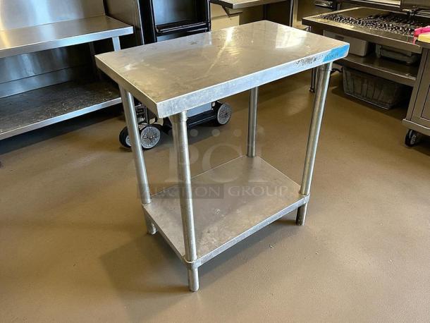 GSW stainless steel worktop table, in great condition. Features a sturdy design with lower shelf. Ideal for kitchens.