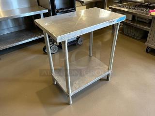 GSW stainless steel worktop table, in great condition. Features a sturdy design with lower shelf. Ideal for kitchens.