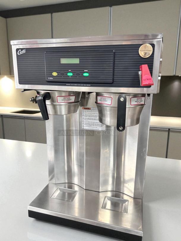 Wilbur Curtis D1000GT12A000 twin 1.5-gallon coffee brewer, stainless steel, 220V, great condition, tested and working.