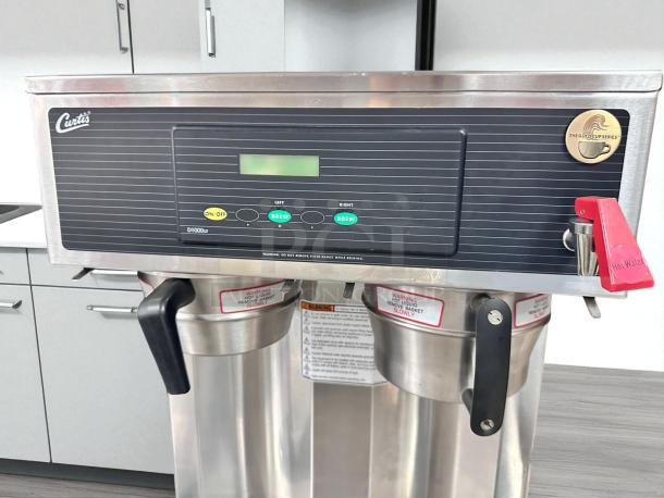 Wilbur Curtis D1000GT12A000 coffee brewer, twin 1.5 gal, great condition, 220V, fully tested, Curtis logo visible.