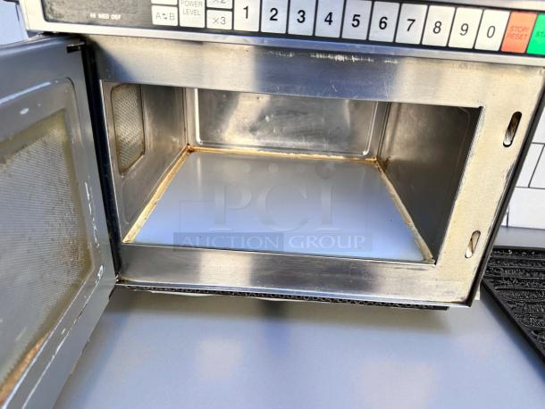 Panasonic commercial microwave in excellent condition, heavy-duty stainless steel, fully tested, open door showing interior.